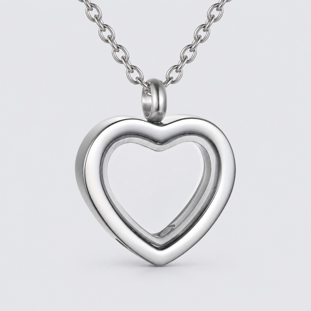 A heart-shaped memorial pendant setting on a chain.